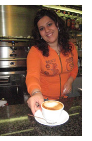 lorena serving proper cappucchino in Panicale, umbria, italy